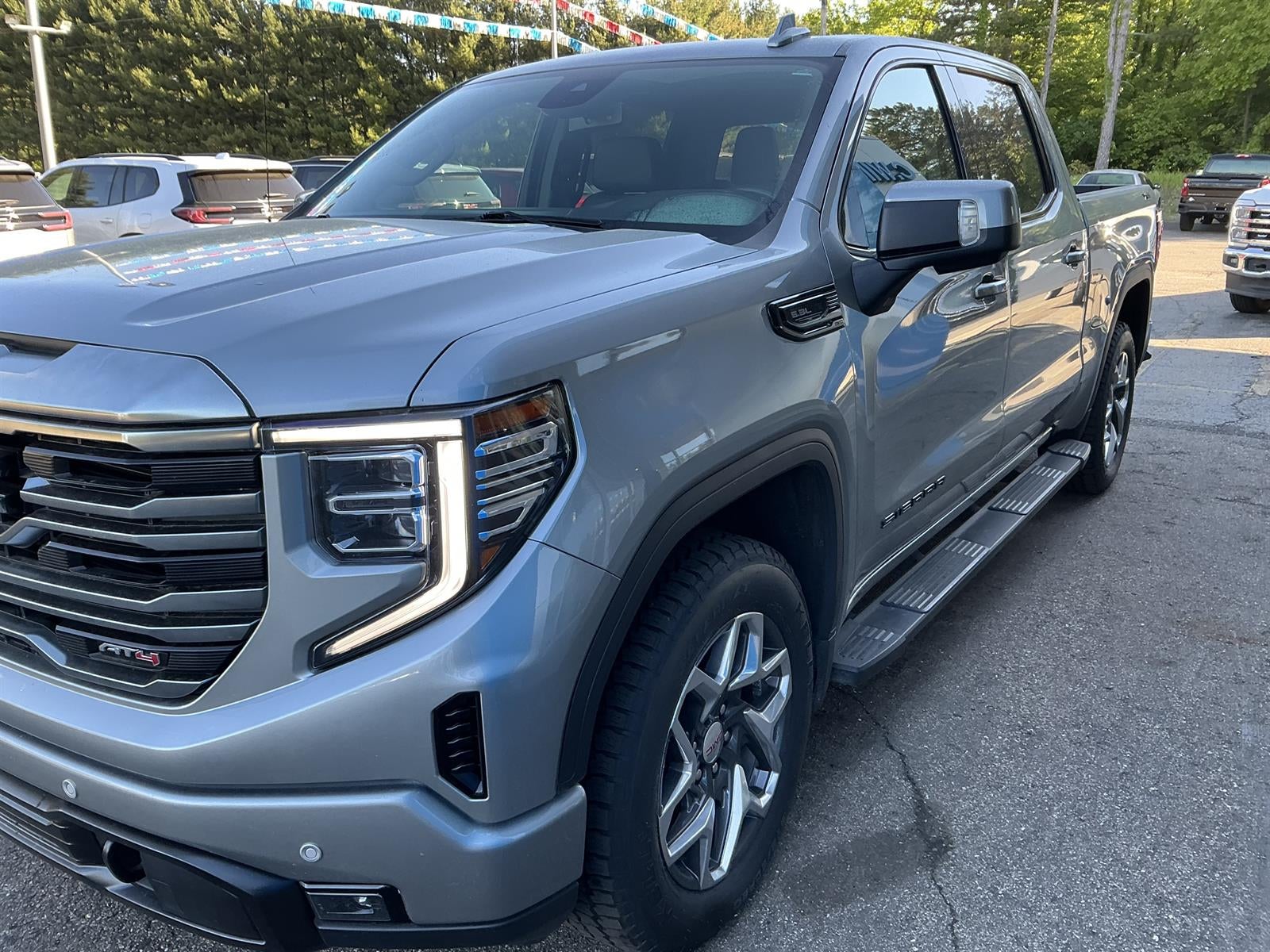 2024 GMC Sierra 1500 SLT in Sterling Metallic — front three-quarter view